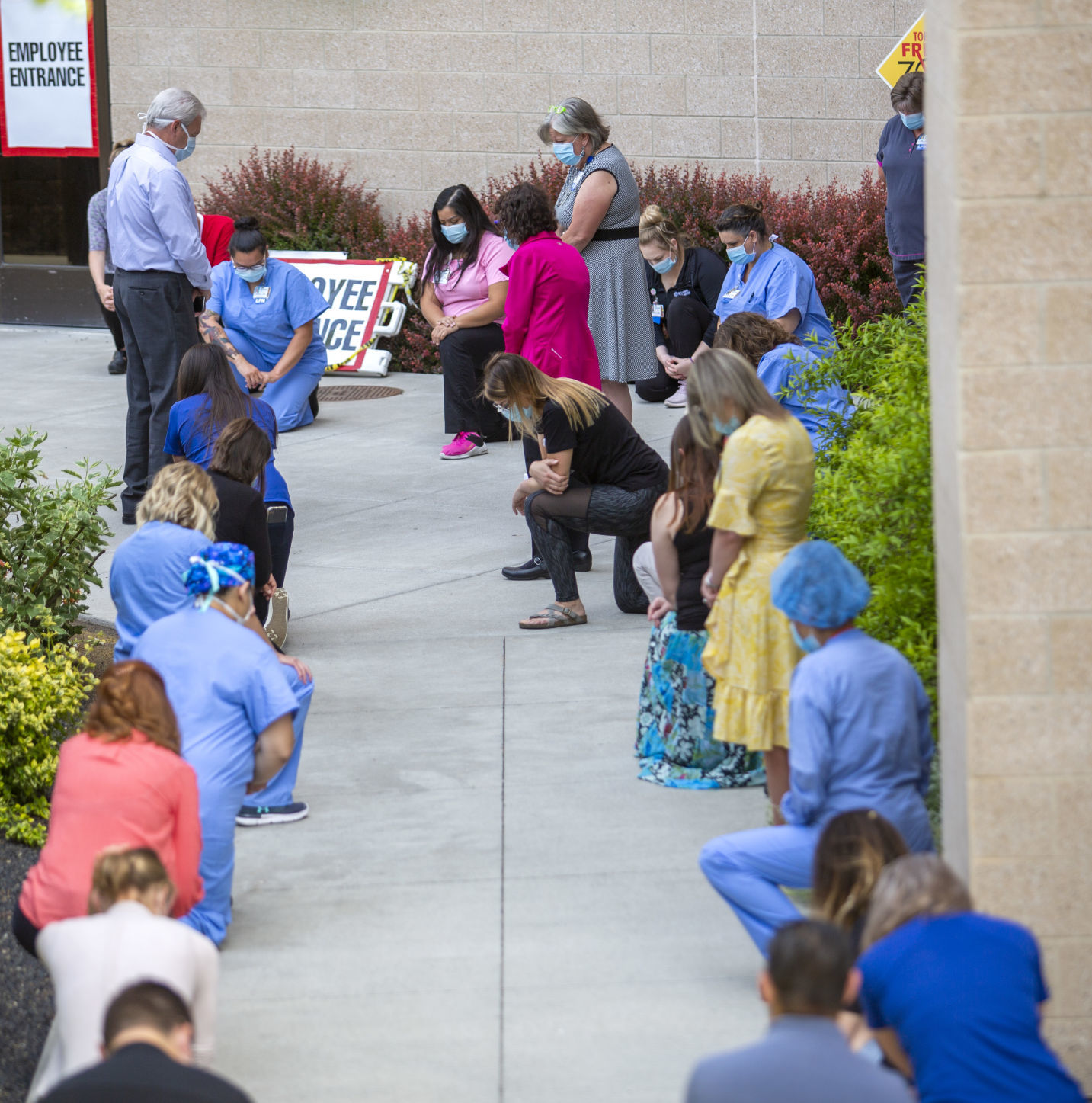 Hospital staff show solidarity with moment of silence